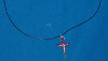 Hematite cross on 24 inch adjustable black wax cord.